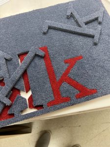 Laser Cut Carpet with Inlayed Lettering